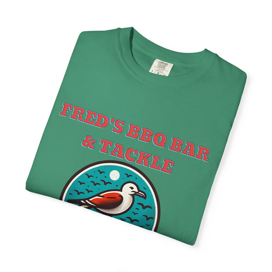 Green cotton short sleeve t-shirt wit fred's bbq bar and tackle written on the front in red with a pigeon graphic
