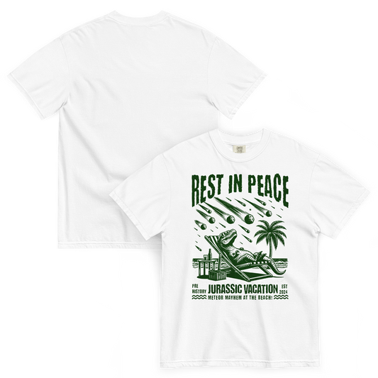White cotton short sleeve t-shirt with a t-rex sitting in a chair while asteroids fall and the graphic is in all green