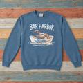 Bar Harbor lobster boat sweatshirt front in Blue Jean on colorful weathered driftwood boards