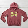 Crimson Key West hoodie front flat lay on whitewashed boards by Five Tides Apparel
