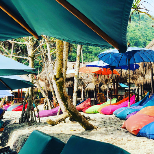 summer vacation on the beach with beach chairs and blankets