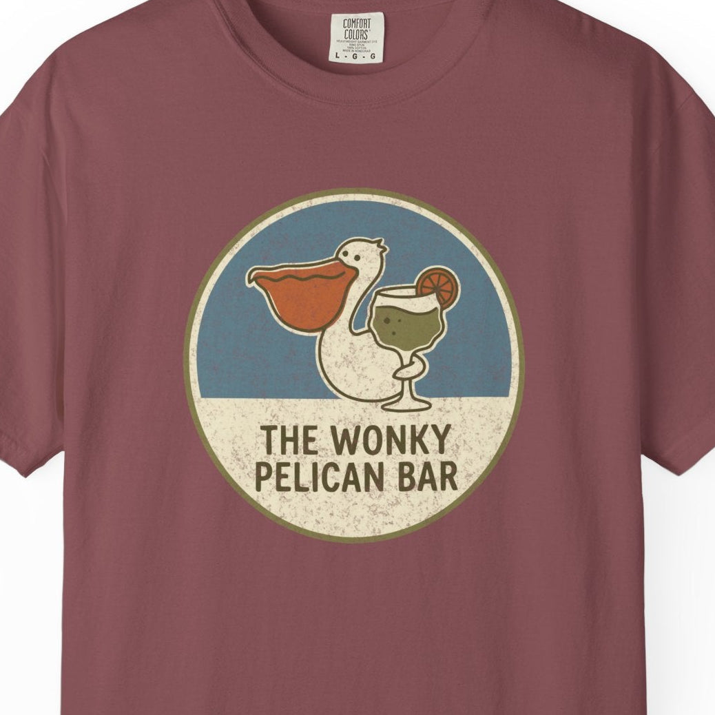 Maroon t-shirt with 'The Wonky Pelican Bar' logo on a white background