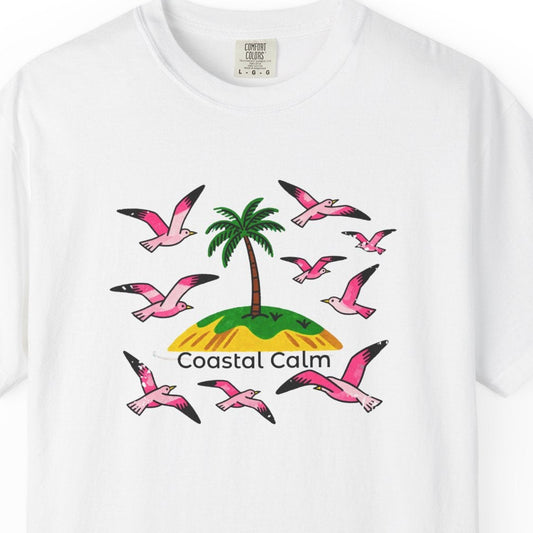 White t-shirt with a tropical graphic and 'Coastal Calm' text on a white background