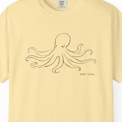 Yellow t-shirt with an octopus design on a white background