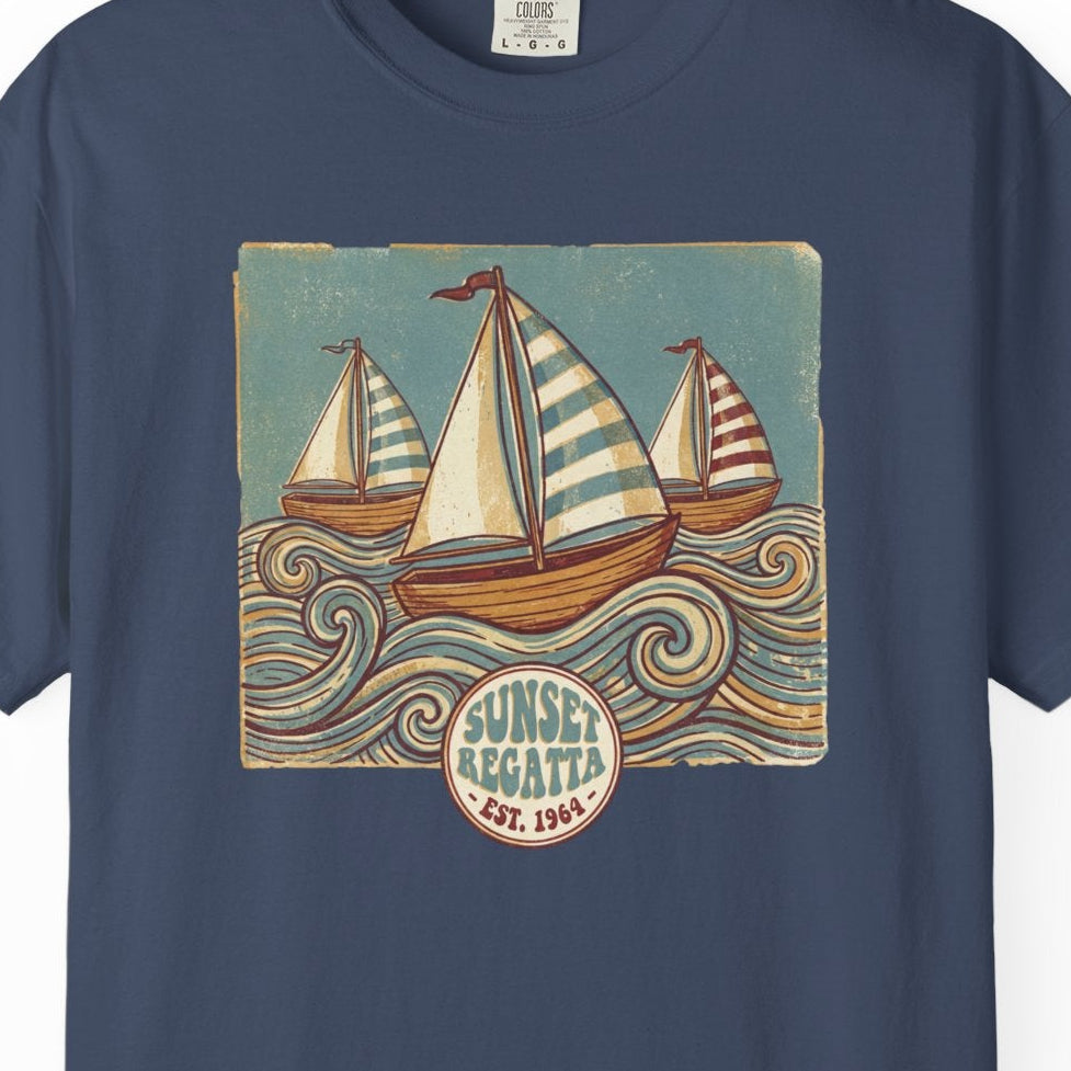 Navy blue t-shirt with sailboat graphic and 'Sunset Yachts' logo on a white background