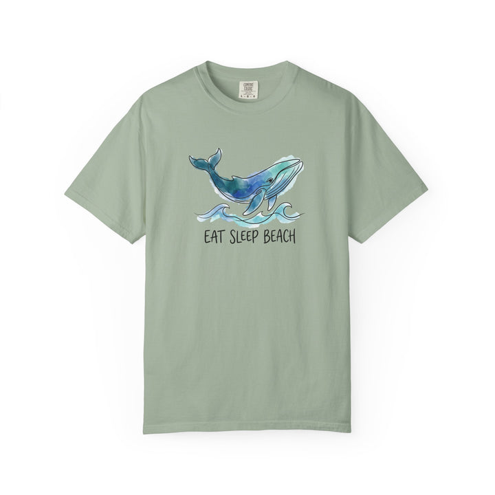 Green t-shirt with a whale graphic and &