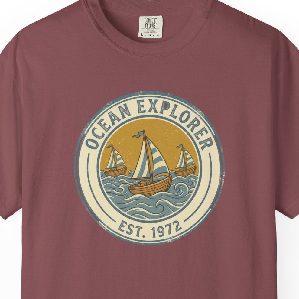 Maroon t-shirt with 'Ocean Explorer' graphic on a white background