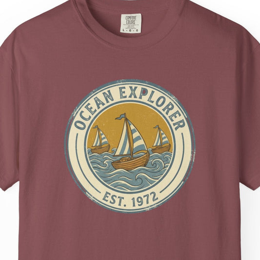Maroon t-shirt with 'Ocean Explorer' graphic on a white background