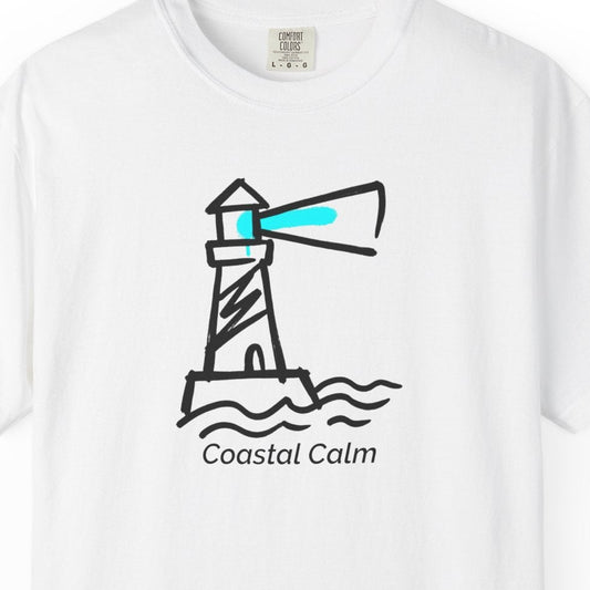 White t-shirt with a lighthouse graphic and 'Coastal Calm' text on a white background