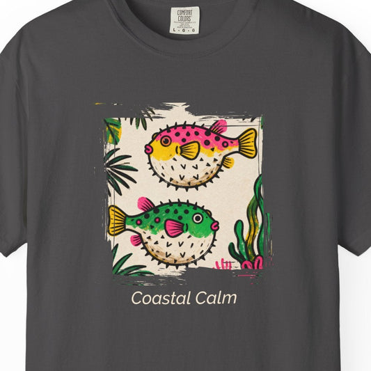 Gray t-shirt with colorful fish design and 'Coastal Calm' text on a white background