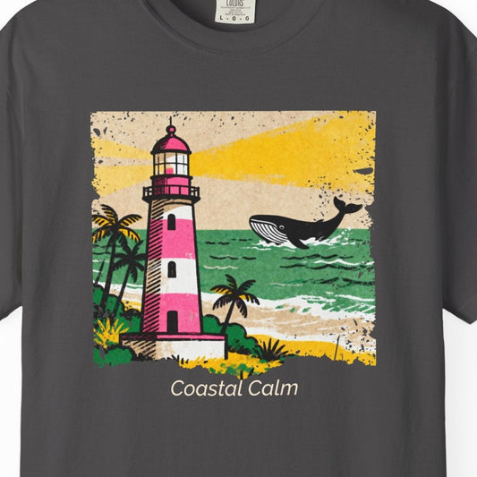 Gray t-shirt with a lighthouse and whale design on a white background