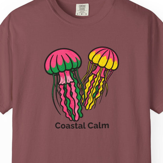Maroon t-shirt with colorful jellyfish design and 'Coastal Calm' text on a white background