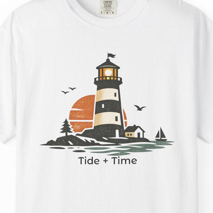 White t-shirt with a lighthouse graphic and 'Tide + Time' text on a white background