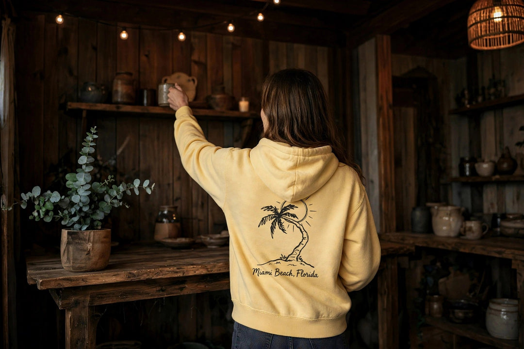 Miami Beach Palm Tree Hoodie — in the Five Tides room, female back