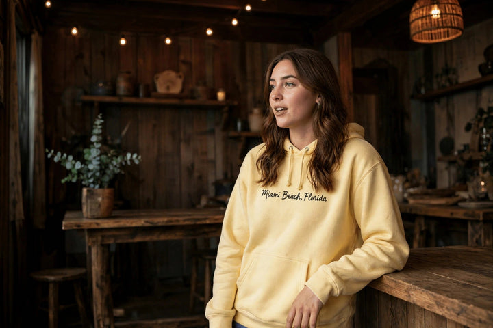 Miami Beach Palm Tree Hoodie — in the Five Tides room, female front