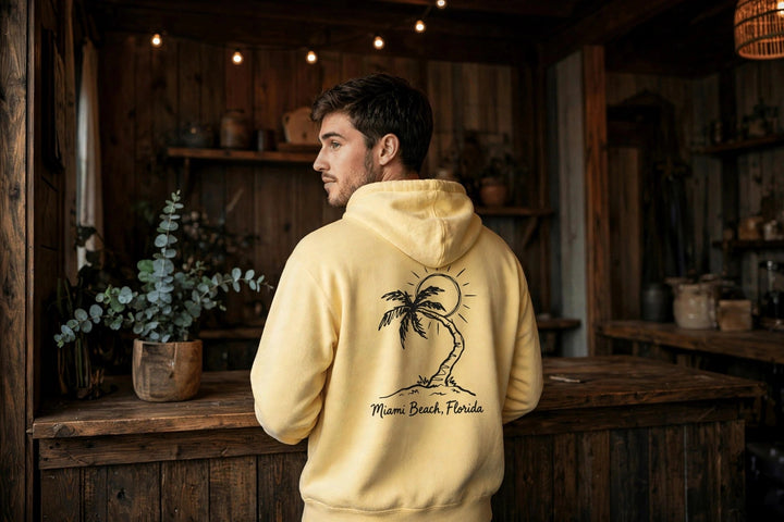 Miami Beach Palm Tree Hoodie — in the Five Tides room, male back