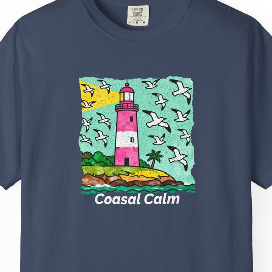 Navy blue t-shirt with a lighthouse graphic and 'Coasal Calm' text on a white background