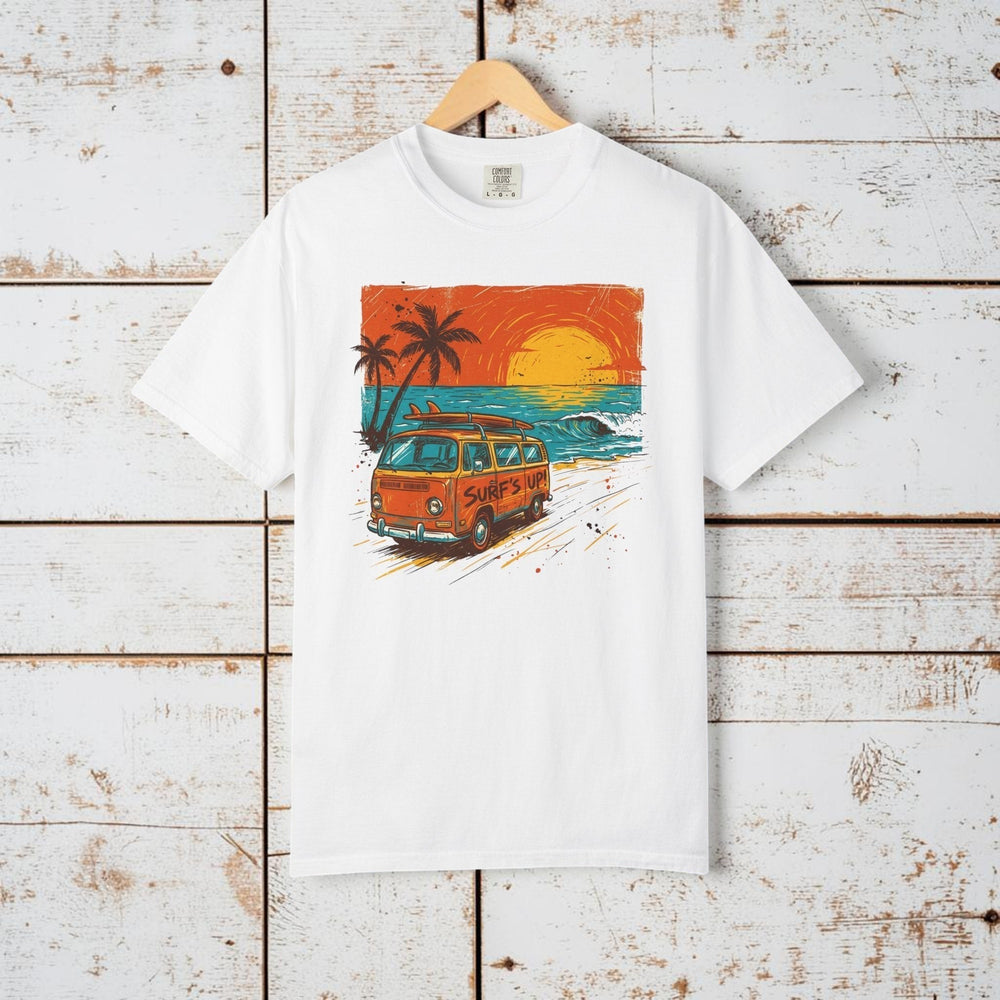 White t-shirt with a graphic of a van, palm trees, and sunset on a beach.