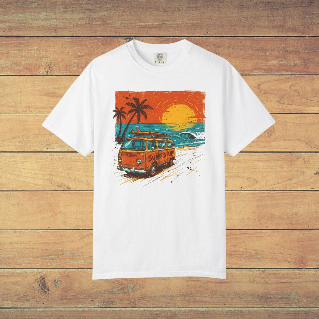 White t-shirt with a graphic of a van, palm trees, and sunset on a beach.
