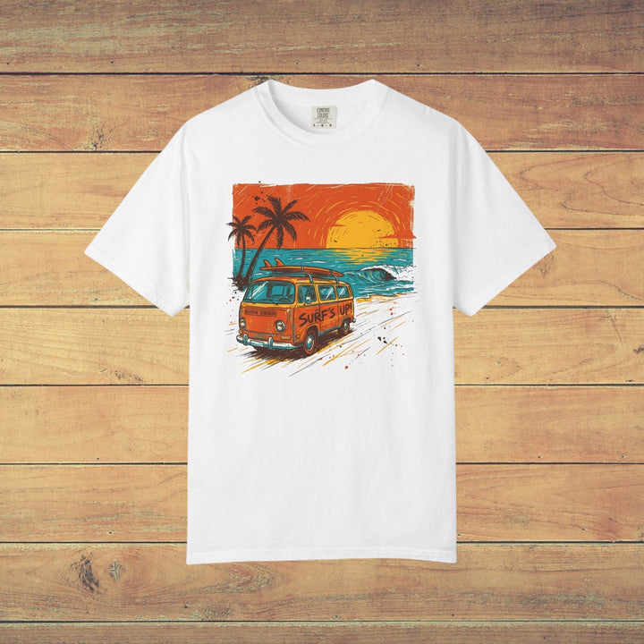 White t-shirt with a graphic of a van, palm trees, and sunset on a beach.