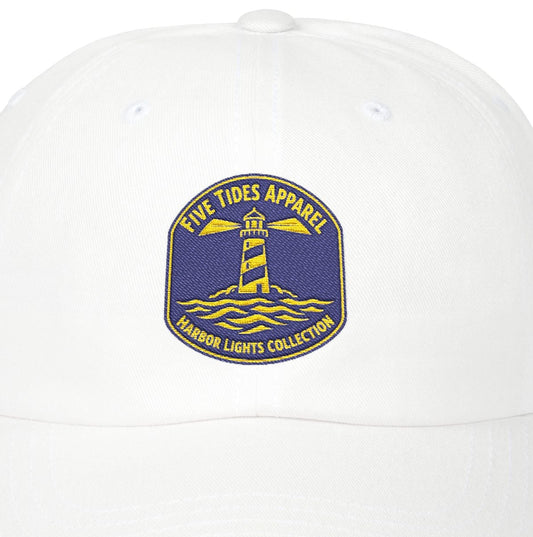 White cap with a lighthouse logo and text on a white background