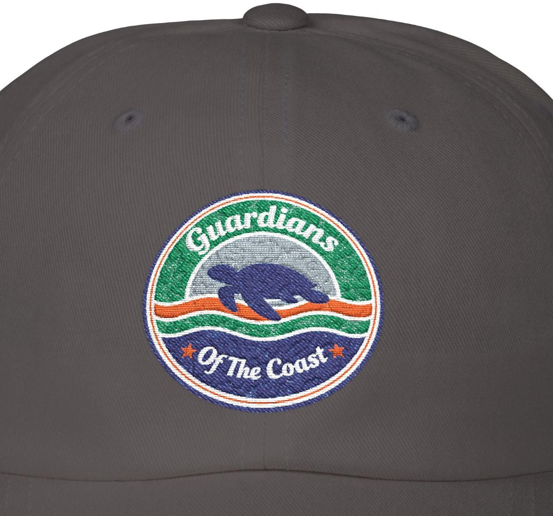 Dark gray cap with 'Guardians of the Coast' logo featuring a turtle on a white background