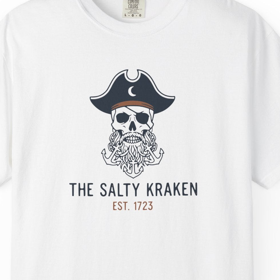 White t-shirt with a skull wearing a pirate hat and beard graphic, labeled 'The Salty Kraken'.