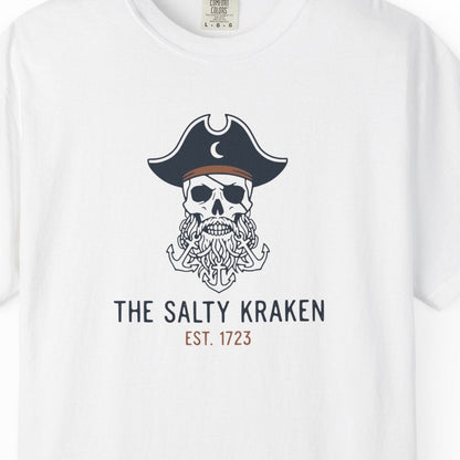 White t-shirt with a skull wearing a pirate hat and beard graphic, labeled 'The Salty Kraken'.