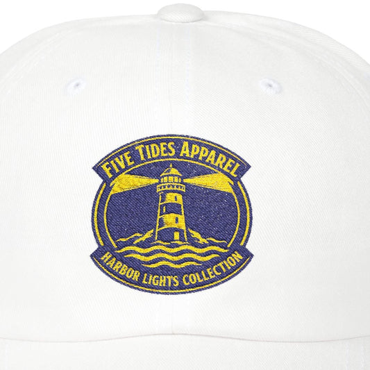 White cap with a lighthouse logo and text on a white background