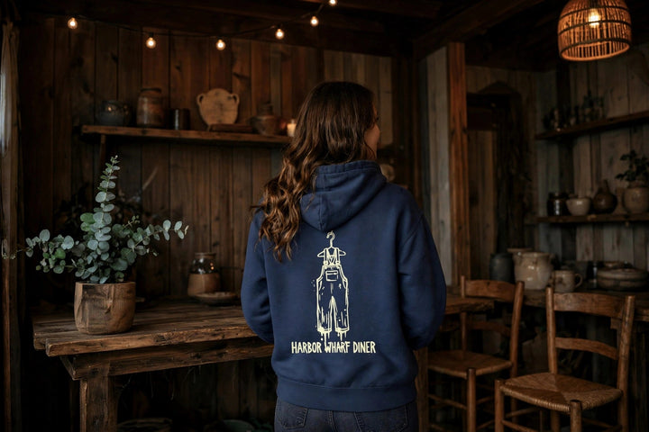 Harbor Wharf Diner Hoodie — in the Five Tides room, female back