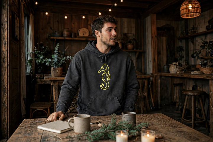 Neon Seahorse Hoodie — in the Five Tides room, male front