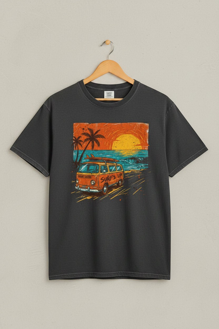 Gray t-shirt with a graphic of a van and palm trees on a beach at sunset.