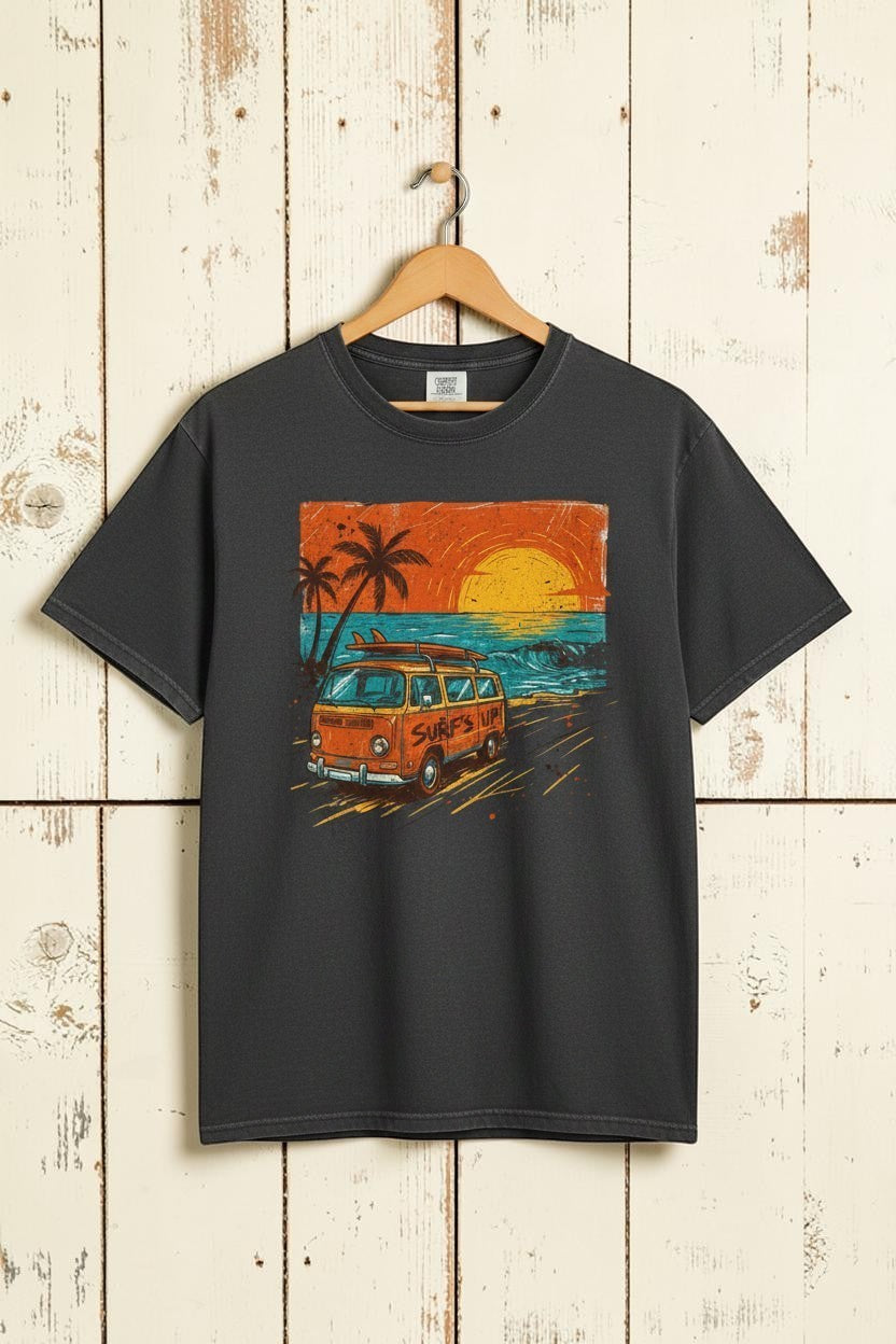 Gray t-shirt with a graphic of a van and palm trees on a beach at sunset.