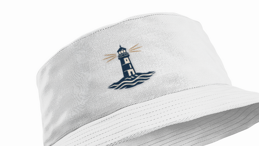 White bucket hat with a lighthouse emblem on a white background