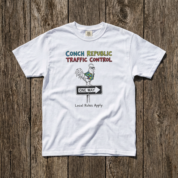 White t-shirt with graphic design on a wooden surface