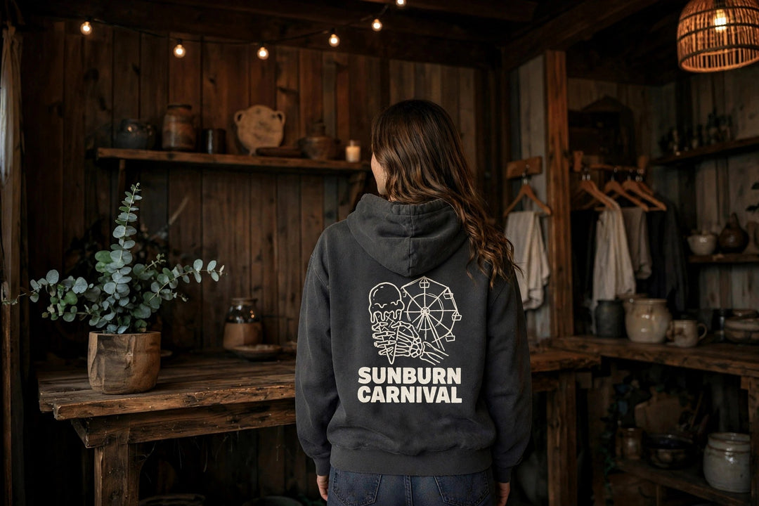 Sunburn Carnival Hoodie — in the Five Tides room, female back