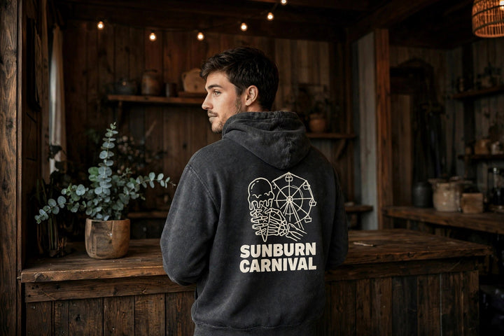 Sunburn Carnival Hoodie — in the Five Tides room, male back