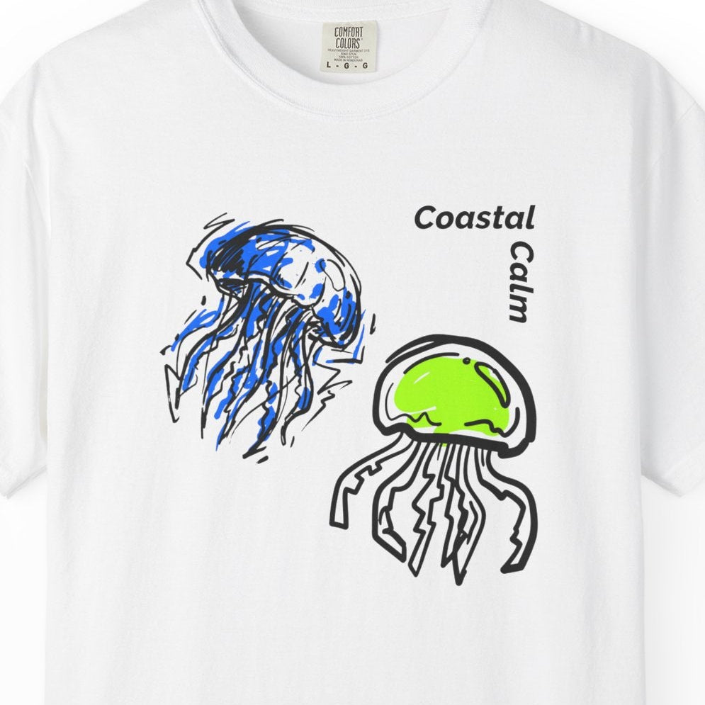 White t-shirt with jellyfish design and 'Coastal Calm' text on a white background
