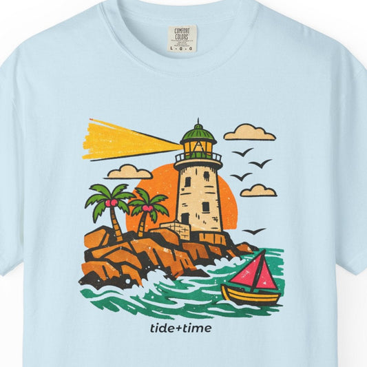 Light blue t-shirt with a lighthouse and sailboat graphic on a white background