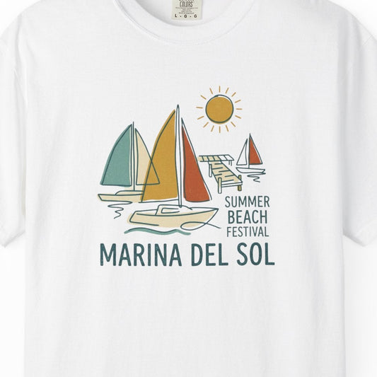 White t-shirt with sailboat graphic and 'Marina del Sol' text on a white background