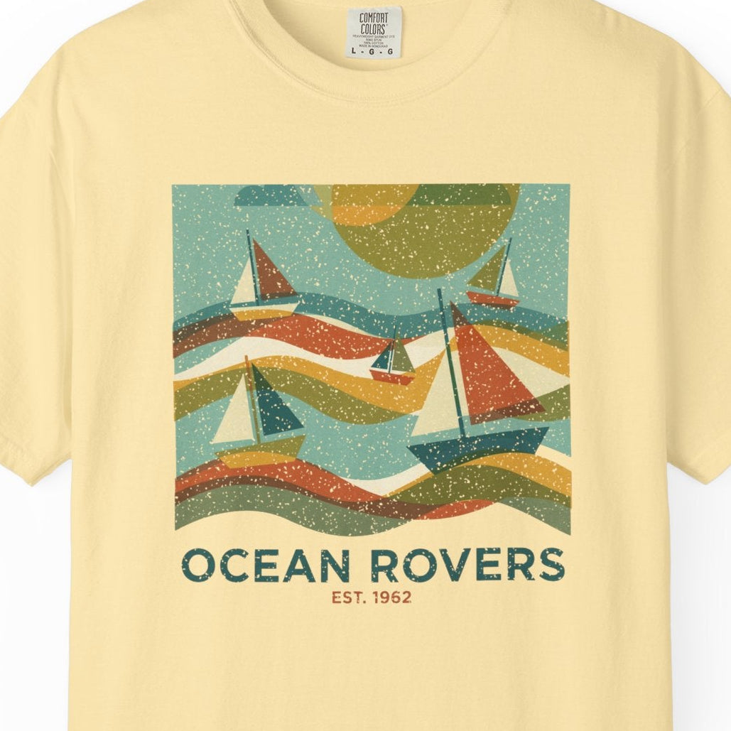 Yellow t-shirt with 'Ocean Rovers' graphic design on a white background