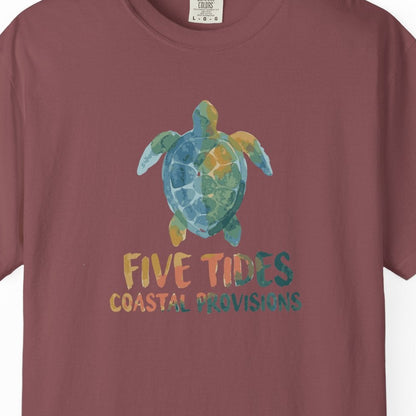 Maroon t-shirt with a turtle graphic and text on a white background