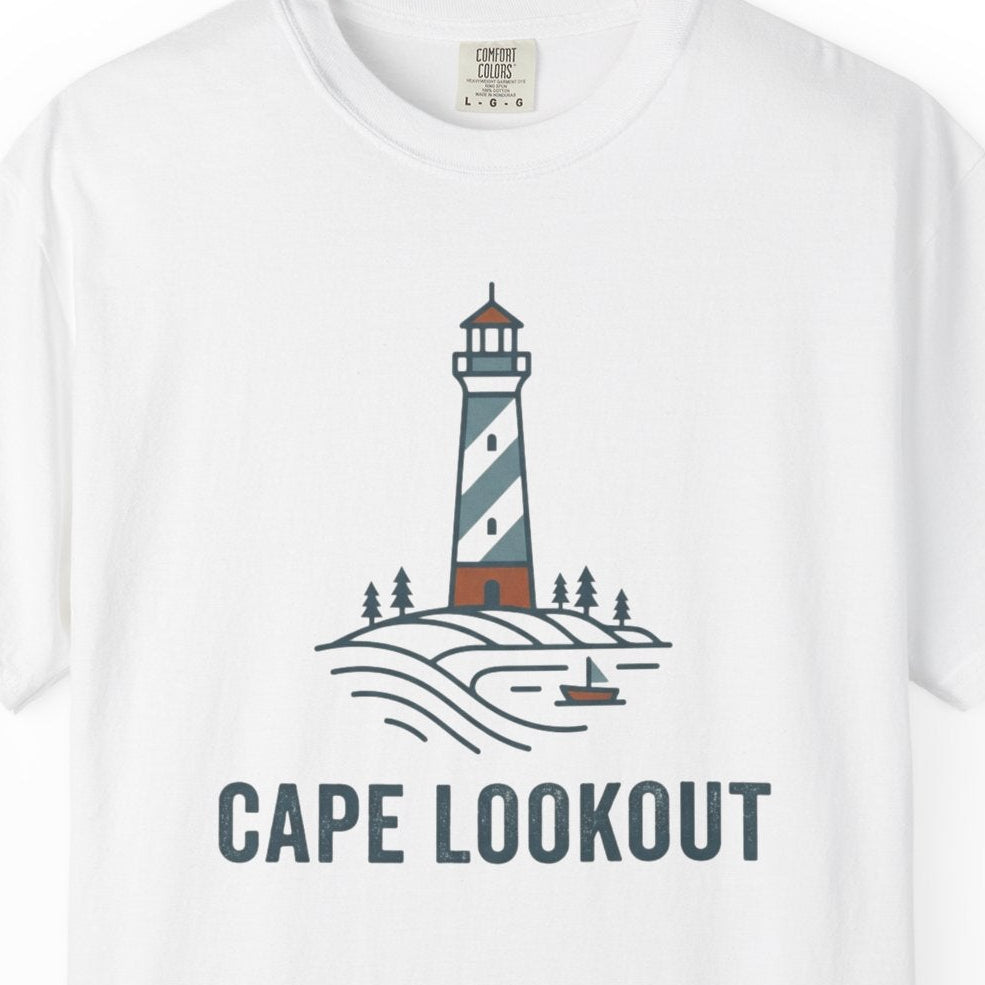 White t-shirt with a lighthouse graphic and 'Cape Lookout' text on a white background