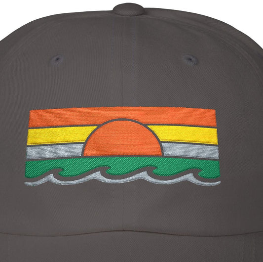 Black cap with a colorful sunset design on a white background