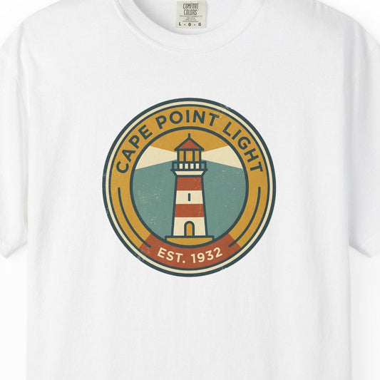 White t-shirt with a lighthouse graphic and text on a white background