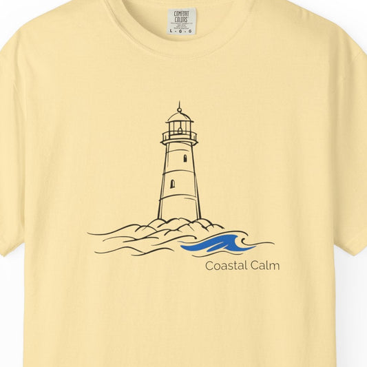 Yellow t-shirt with a lighthouse design and 'Coastal Calm' text on a white background