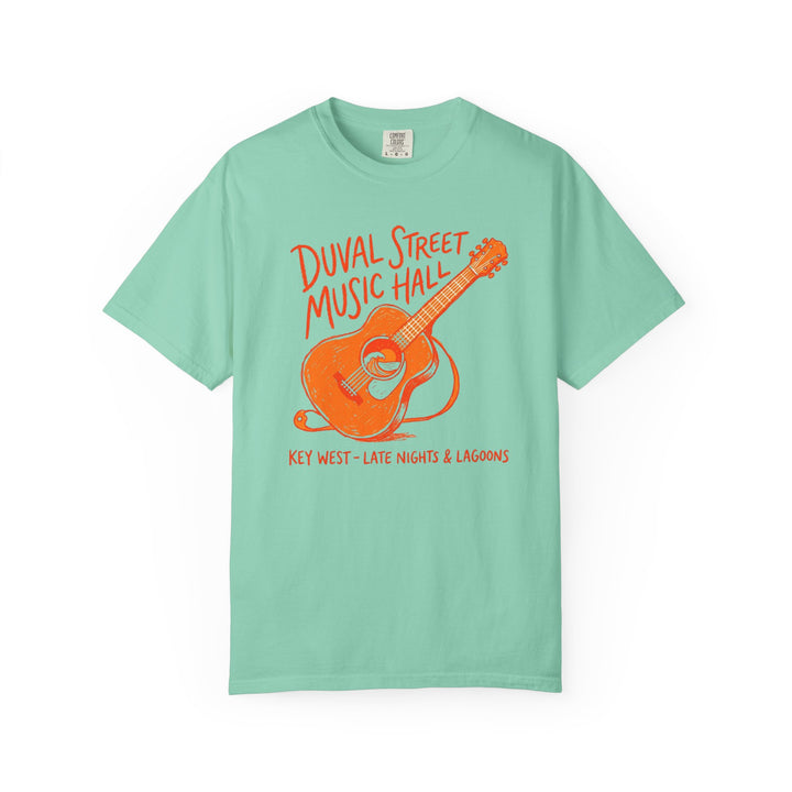 Mint green t-shirt with orange guitar graphic and text on a white background