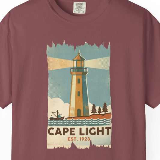 Maroon t-shirt with a lighthouse graphic and 'Cape Light' text on a white background