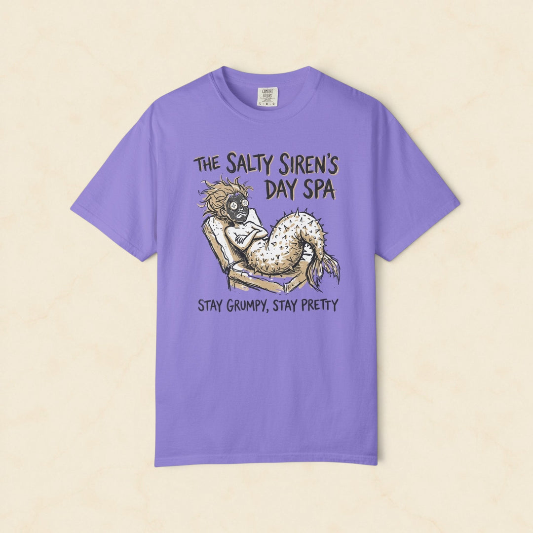 Purple t-shirt with a mermaid graphic and text on a white background