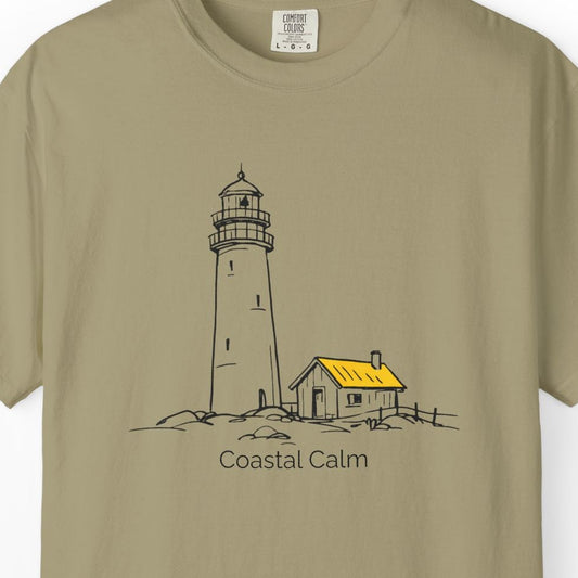 Beige t-shirt with a lighthouse graphic and 'Coastal Calm' text on a white background